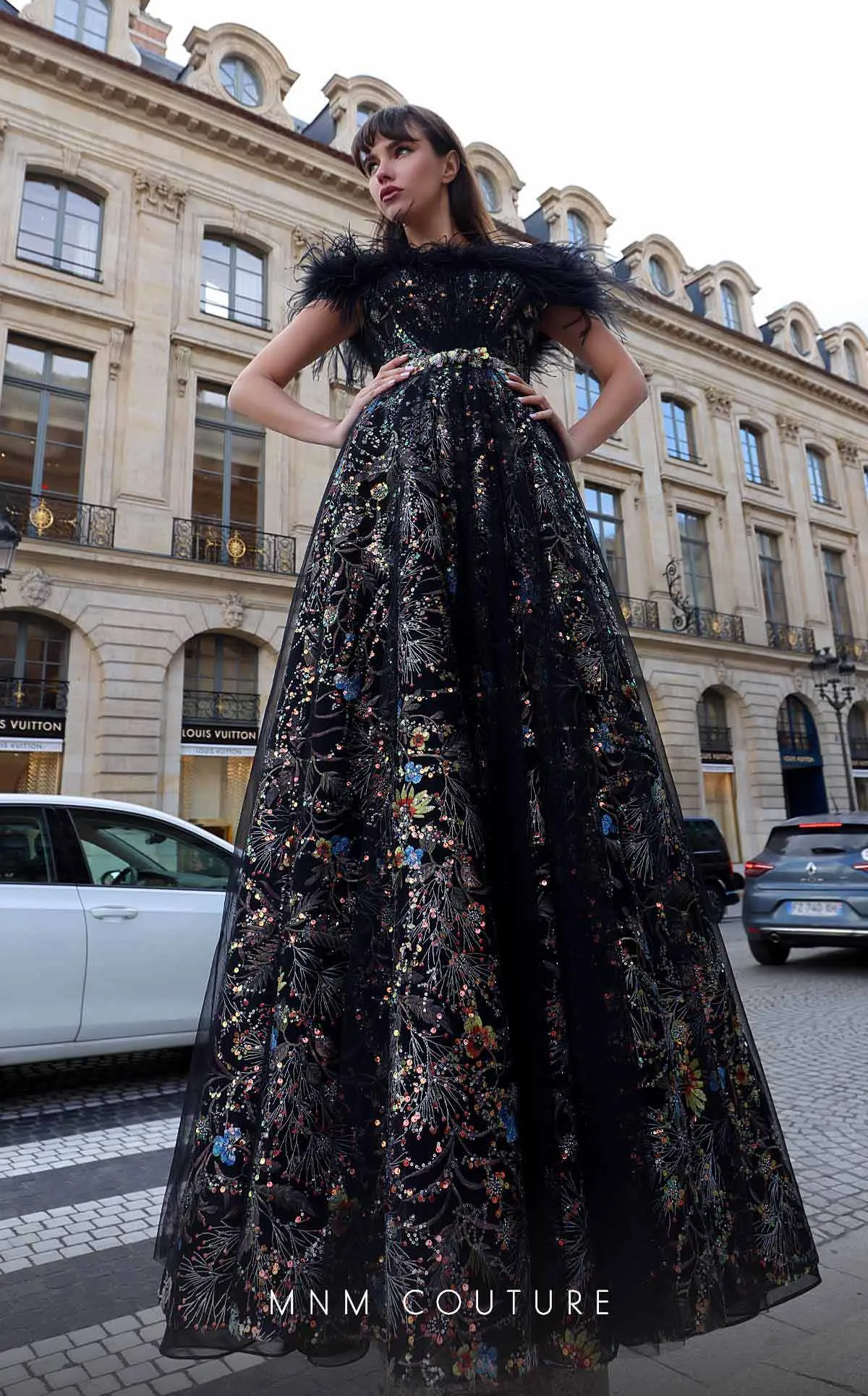 MNM Couture K4021 : Couture Drama in a Strapless Feathered Gown.