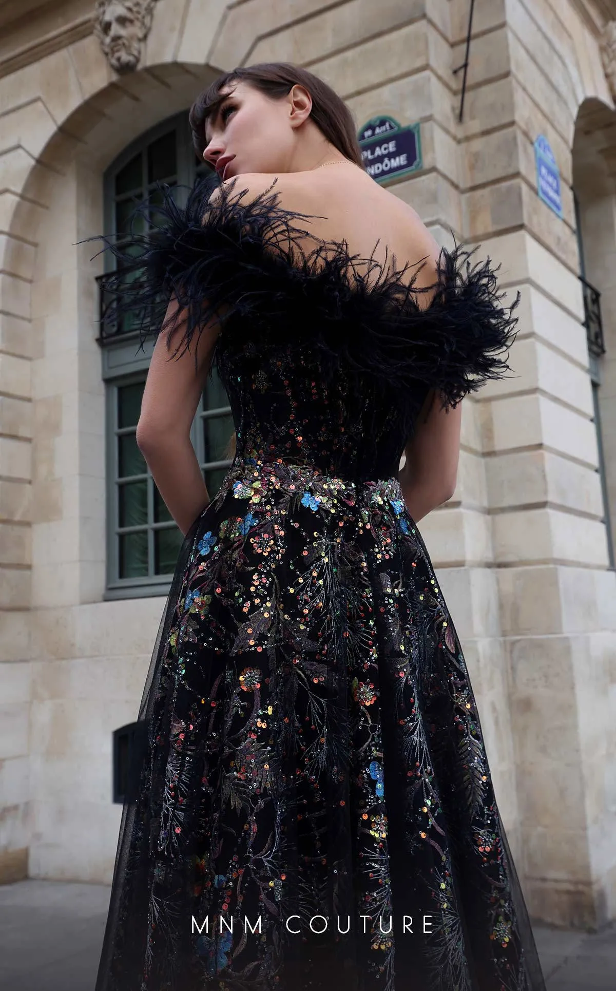 MNM Couture K4021 : Couture Drama in a Strapless Feathered Gown.